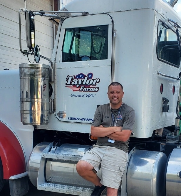 Ryan Taylor leaning against water delivery truck | Water Delivery Service | Taylor Farms Water Hauling | Eastern Panhandle WV