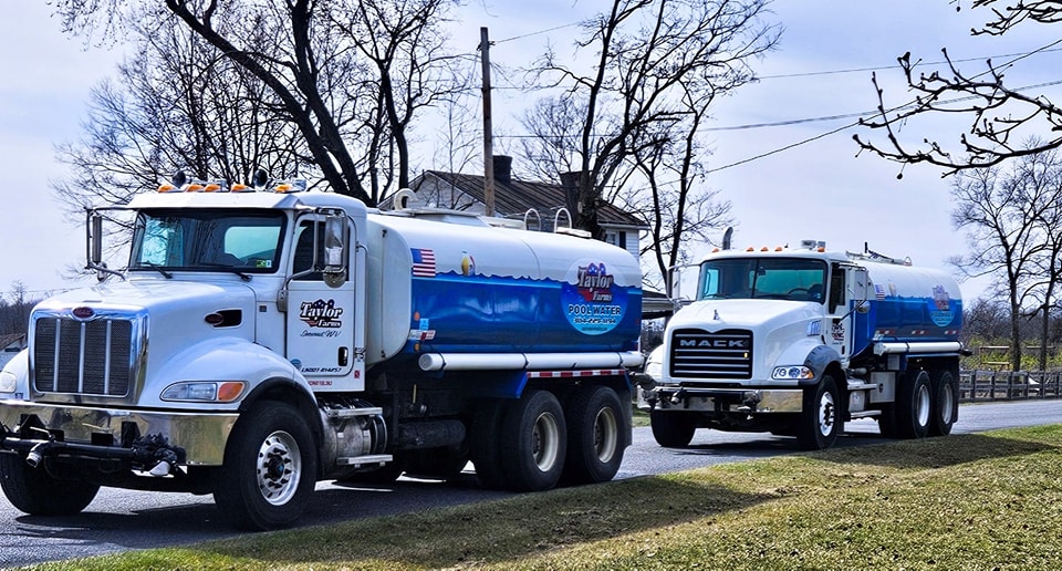 Two Taylor Farms Water Hauling Trucks | Emergency Water Delivery Taylor Farms Water Hauling | Eastern Panhandle WV