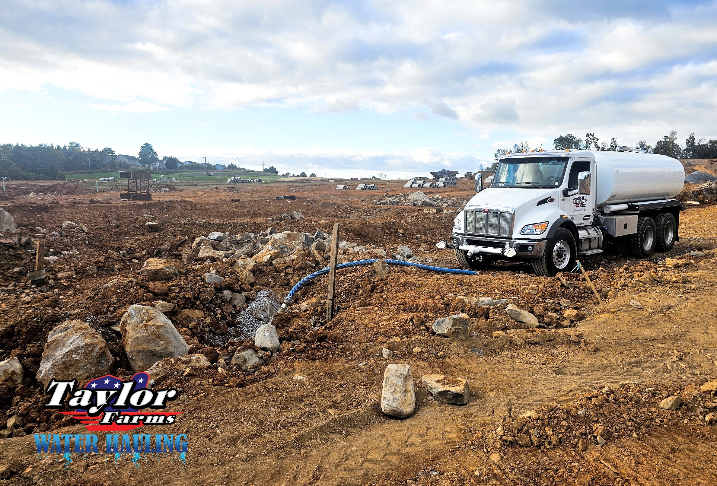 Water hauling truck delivering water to a construction site for dust control | Water Hauling | Taylor Farms Water Hauling