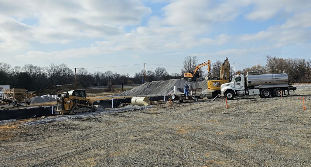 Water hauling truck delivering water for concrete mixing and pouring | Taylor Farms Water Hauling