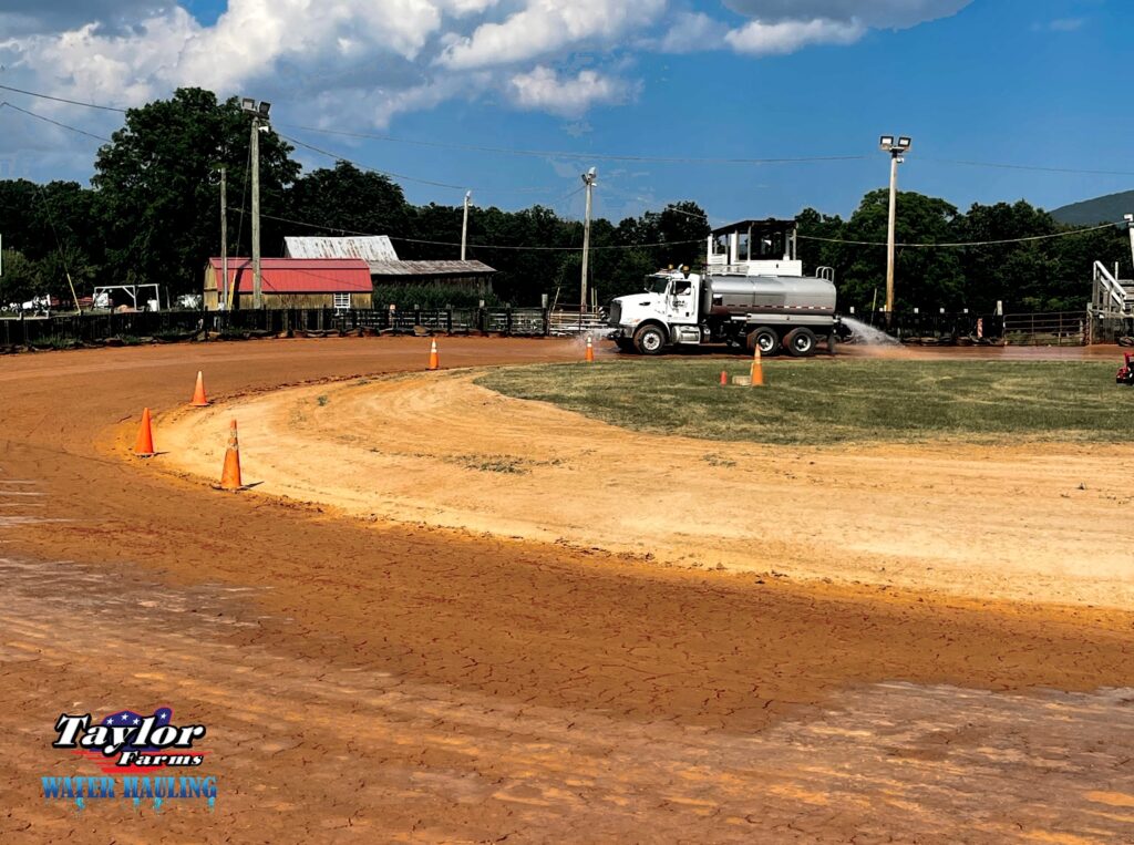 Dust control using a water hauling truck from Taylor Farms Water Hauling