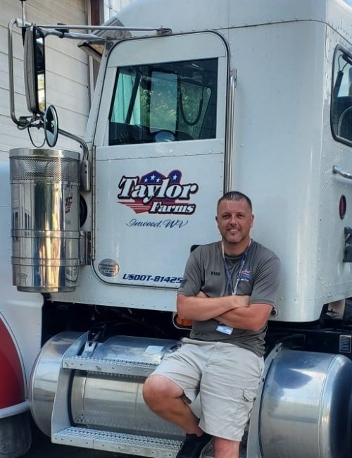 Ryan Taylor leaning against water delivery truck | Water Delivery Service | Taylor Farms Water Hauling | Eastern Panhandle WV